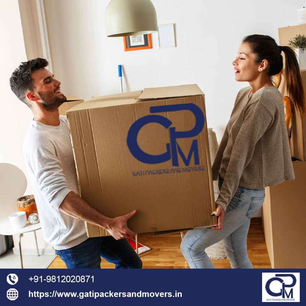 a couple carefully moving their boxes for gati packers and movers hyderabad service